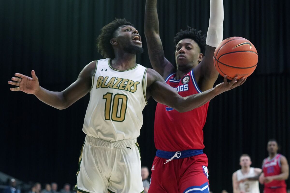 UAB guard Jordan Walker (10) goes in for a layup against Louisiana Tech guard Amorie Archibald (3) during the first half of an NCAA college basketball game for the Conference USA men's tournament championship in Frisco, Texas, Saturday, March 12, 2022. (AP Photo/LM Otero)