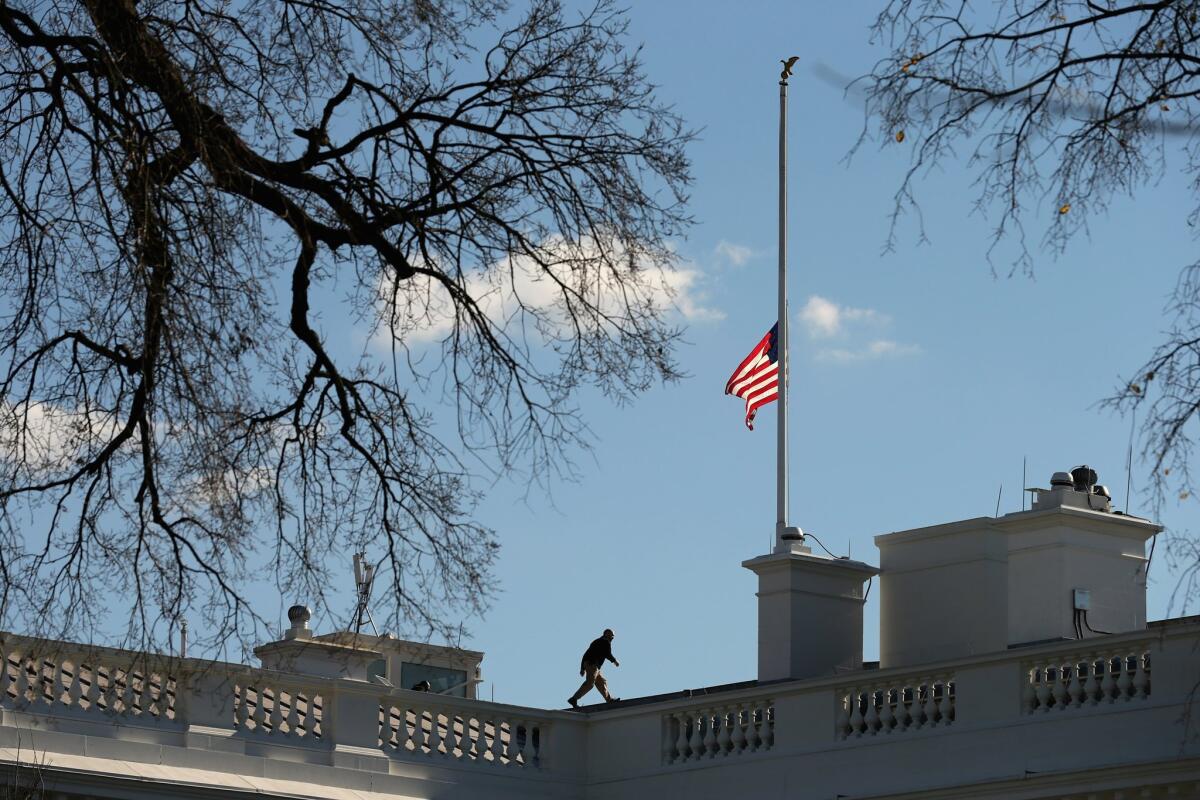 The American flag flys at half-staff above the White House Dec. 3, a day after the terrorist attack in San Bernardino.