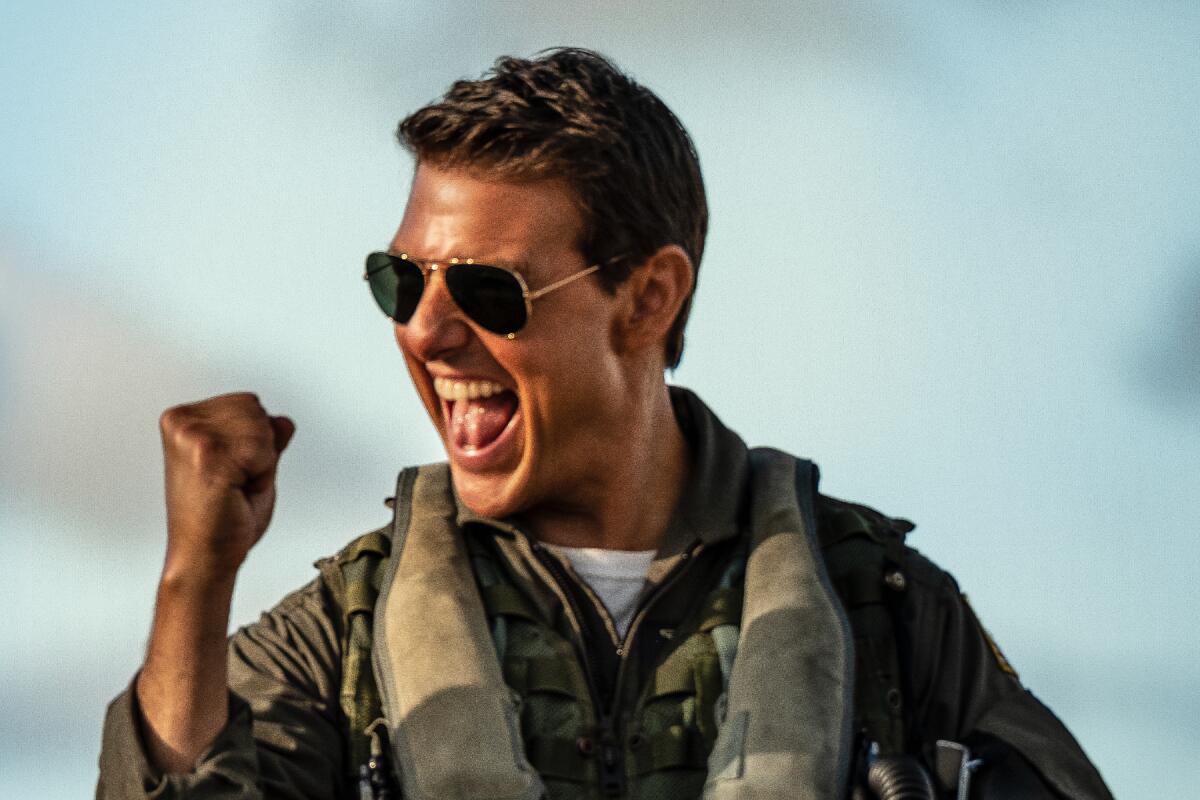 Tom Cruise pumps his fist in triumph in "Top Gun: Maverick."