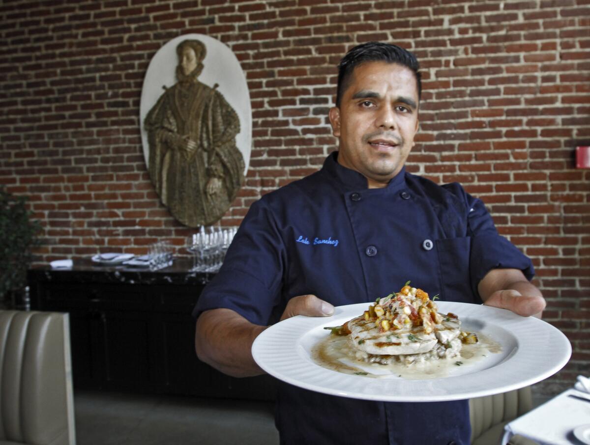 Chef Lalo Sanchez shows off the Swordfish dish, which includes roasted corn and shrimp salsa, at Crossings Restaurant at 1010 Mission Ave., South Pasadena, on Thursday Aug. 7, 2014.