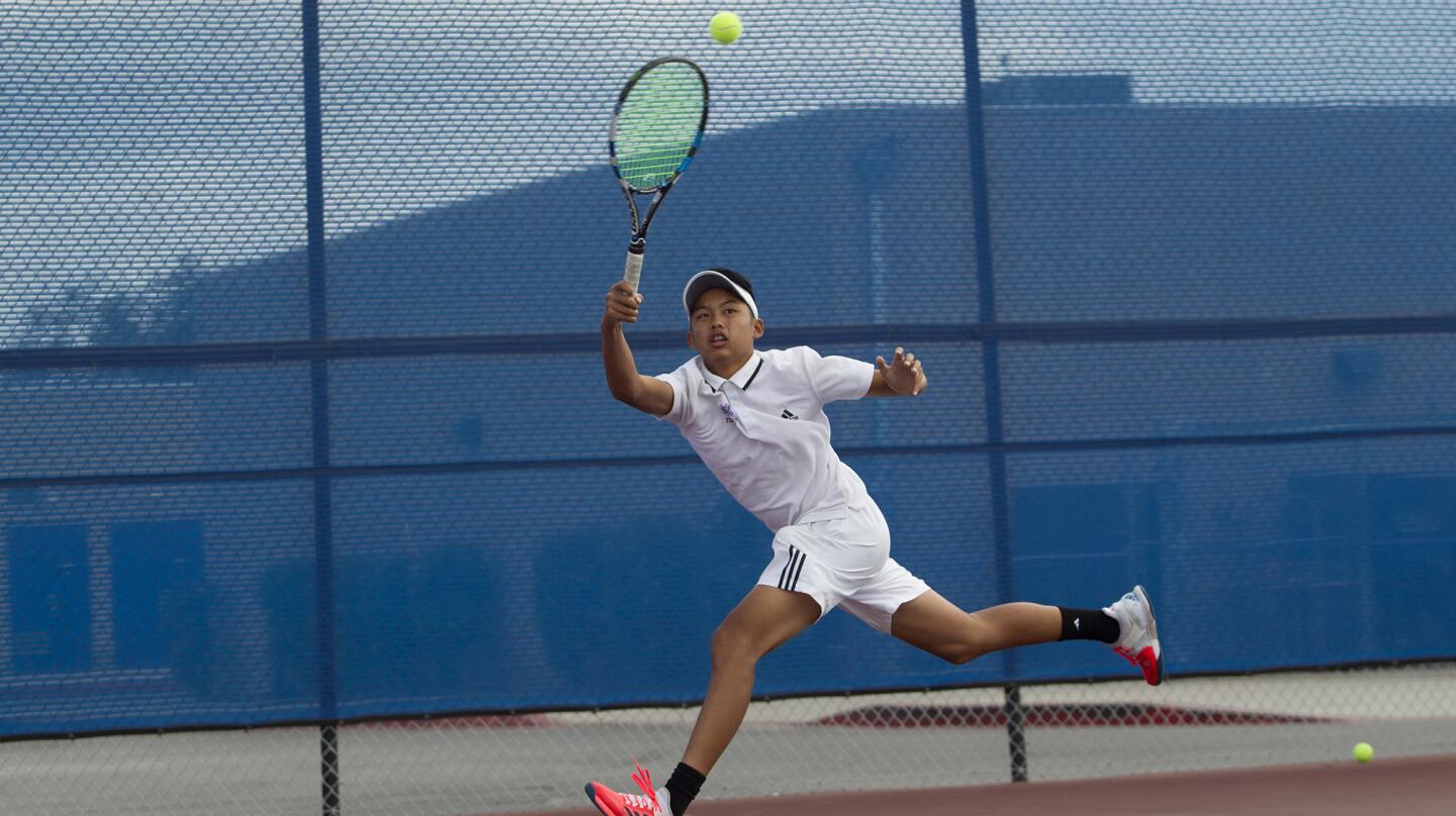 Fountain Valley High's Ryan Trinh battles during a singles set against Yorba Linda in a CIF Southern Section Division 2 quarterfinal playoff match in Fountain Valley on Monday. (Kevin Chang/ Daily Pilot)