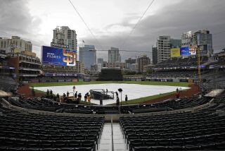 San Diego, CA - October 15: The tarp was put on the field because of rain during batting practice at Petco Park before Game 4 of the NLDS on Saturday, October 15, 2022 in San Diego, CA. (K.C. Alfred / The San Diego Union-Tribune)