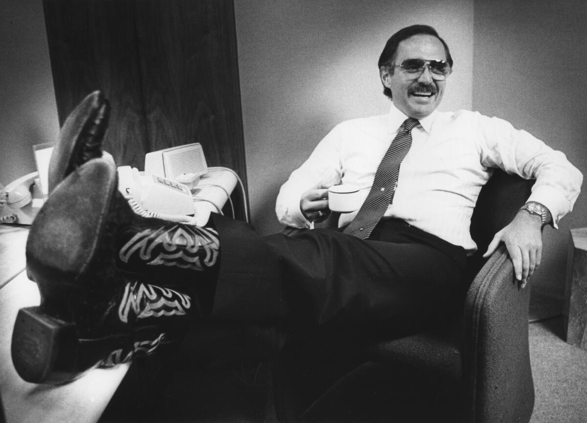 Dan Pena waits for his plane, which will take him to Texas to close an oil deal.