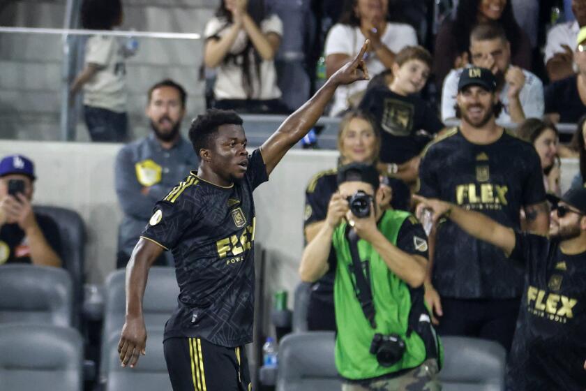 Los Angeles FC forward Kwadwo Opoku (22) celebrates his goal against FC Dallas during the second half of an MLS soccer match in Los Angeles, Wednesday, June 29, 2022. Los Angeles won 3-1. (AP Photo/Ringo H.W. Chiu)
