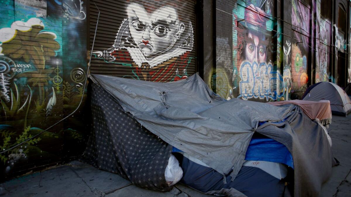 Homeless people's tents near the corner of East 4th Street and Towne Avenue last Thanksgiving.