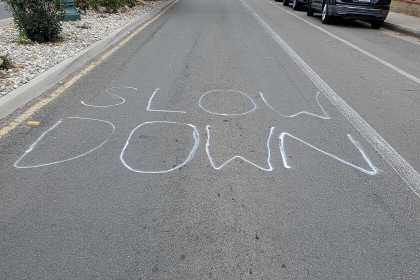A message reading "Slow down" has been written repeatedly on La Jolla Boulevard and other streets.