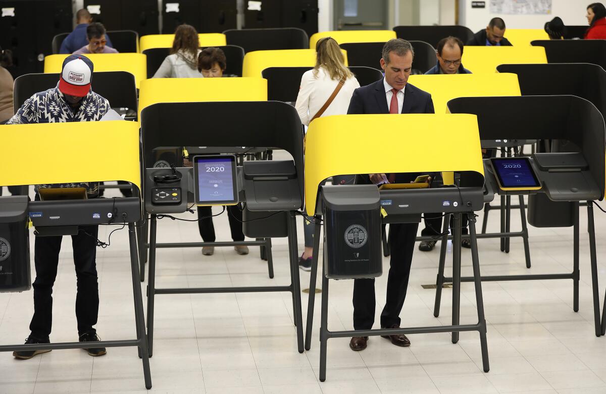 Los Angeles Mayor Eric Garcetti votes at Wilshire Park Elementary School on Tuesday morning