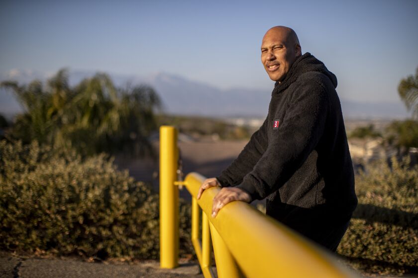 CHINO HILLS, CA - MARCH 16, 2021: LaVar Ball stands at a trailhead where he use to train his sons in their early years across from Chino Hills State Park on March 16, 2021 in Chino Hills, California. The basketball playing Ball brothers Lonzo, LiAngelo and LaMelo are all expected to play in the NBA this year and put Chino Hills on the map for the rest of the nation.(Gina Ferazzi / Los Angeles Times)