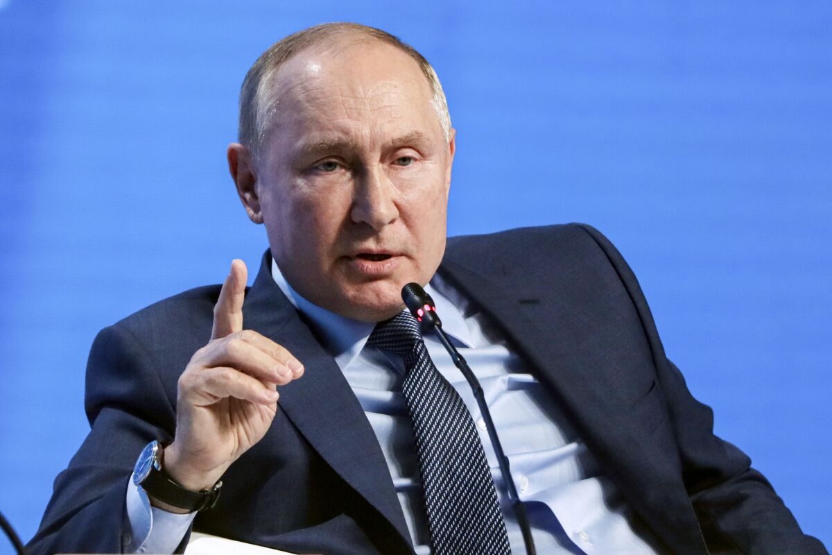 Russian President Vladimir Putin gestures while speaking at the plenary session of the Russian Energy Week in Moscow, Russia, Wednesday, Oct. 13, 2021. (Mikhail Metzel, Sputnik, Kremlin Pool Photo via AP)