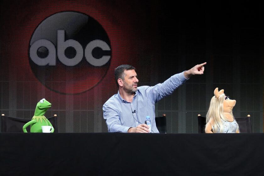 Kermit the Frog, writer/executive producer Bob Kushell and Miss Piggy speak during the "The Muppets" panel discussion at the ABC Entertainment portion of the 2015 Summer TCA Tour at The Beverly Hilton Hotel on Aug. 4, 2015 in Beverly Hills.
