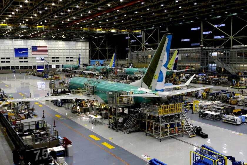 FILE - This Dec. 7, 2015, file photo shows the second Boeing 737 MAX airplane being built on the assembly line in Renton, Wash. A new computer problem has been found in the troubled Boeing 737 Max that will further delay the plane's return to flying after two deadly crashes, according to two people familiar with the matter. The latest flaw in the plane's computer system was discovered by Federal Aviation Administration pilots who were testing an update to critical software in a flight simulator in the fourth week of June 2019 at a Boeing facility near Seattle, the people said. Both spoke on condition of anonymity because the development has not been made public. (AP Photo/Ted S. Warren, File)