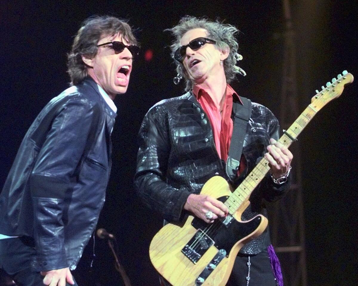 Rolling Stones lead singer Mick Jagger, left, and guitarist Keith Richards, in a 1999 file photo. (Elise Amendola / Associated Press)