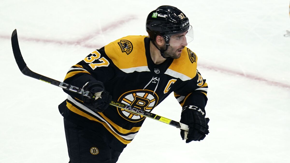 Boston Bruins center Patrice Bergeron skates up the ice during the third period of the team's NHL hockey game against the Detroit Red Wings, Thursday, Nov. 4, 2021, in Boston. (AP Photo/Charles Krupa)