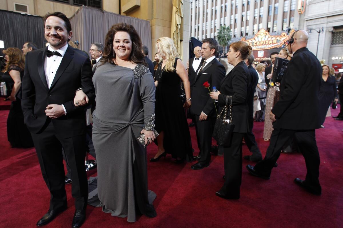 Melissa McCarthy, photographed here with husband Ben Falcone, has responded to film critic Rex Reed's "Identity Thief" review in which he called the actress "tractor-sized."