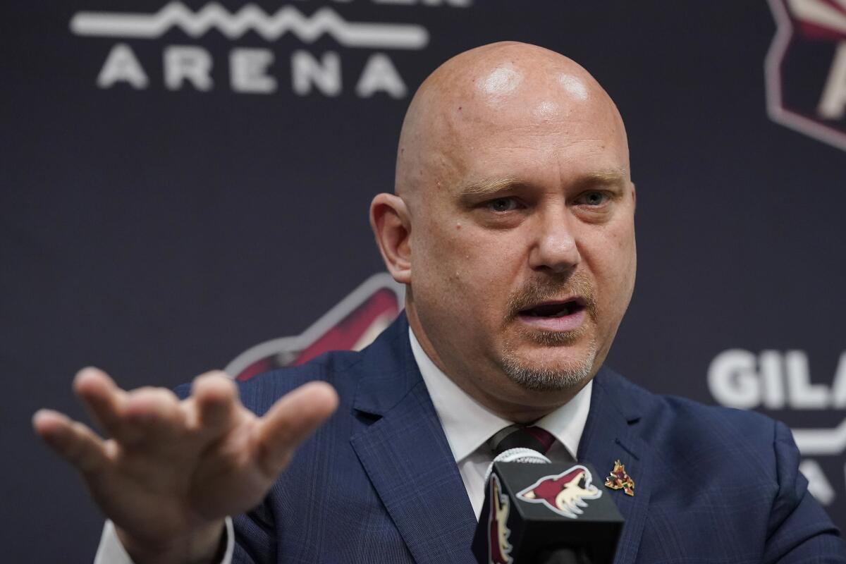 Arizona Coyotes hockey team new head coach Andre Tourigny speaks during a news conference at Gila River Arena Thursday, July 1, 2021, in Glendale, Ariz. (AP Photo/Ross D. Franklin)