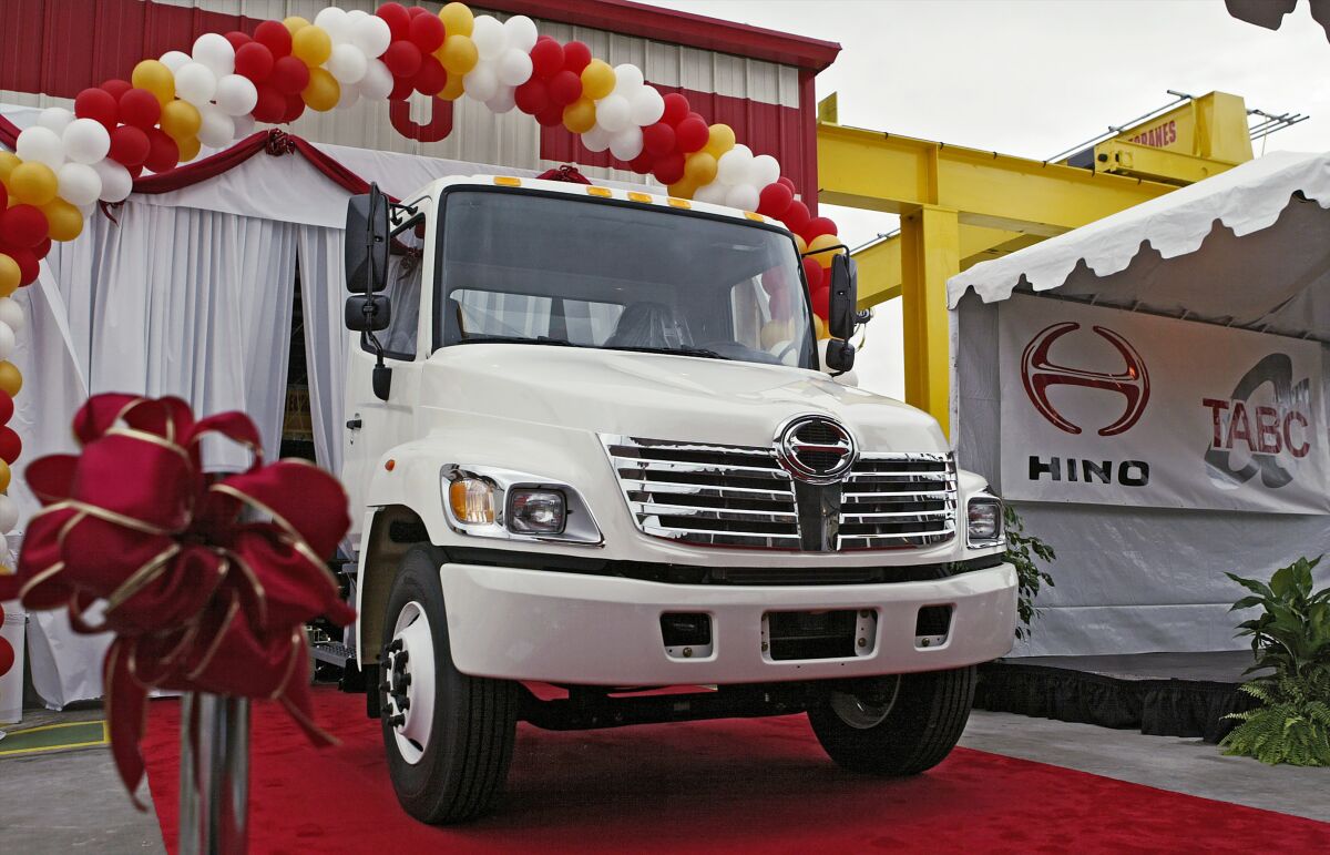 FILE - The first Hino truck assembled in North America is unveiled Tuesday, Oct. 19, 2004, at the Toyota's longest operating U.S. manufacturing facility, TABC, Inc. in Long Beach, Calif. Hino Motors, a truck maker that’s part of the Toyota group, systematically falsified emissions data, dating back as far back as 2003, according to a special investigation disclosed Tuesday, Aug. 2, 2022. (AP Photo/Damian Dovarganes, File)
