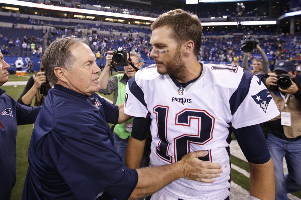 Patriots Coach Bill Belichick and quarterback Tom Brady congratulate each other after a victory over the Colts on Oct. 18.