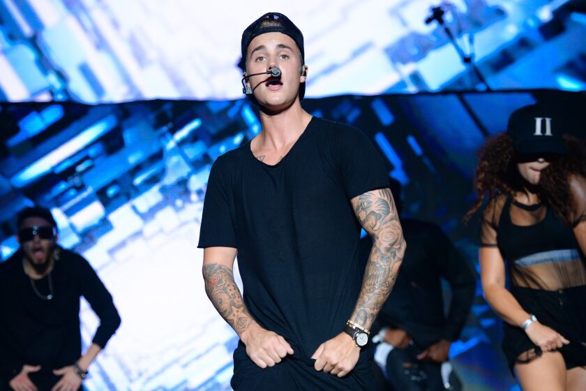 Justin Bieber, seen performing at the Billboard Hot 100 Music Festival in New York, will sing at Sunday's MTV Video Music Awards.