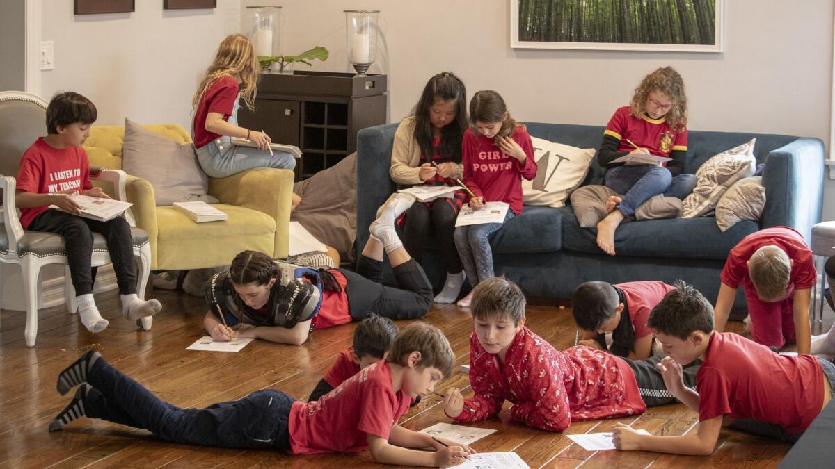 Kids from Encino Charter Elementary School -- dressed in red to support their teachers -- attend a community-organized "strike school" in Encino, Calif. Parents are taking turns hosting kids in their homes and creating a curriculum.