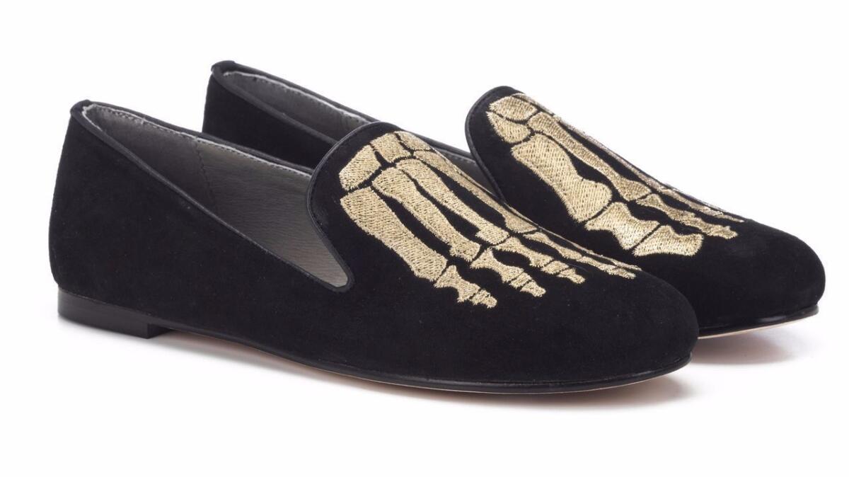 The "Jem Skull" slippers (in black calf hair with an embroidered gold skeleton foot motif) are from Mara & Mine, a brand with Australian ties that's predicated on edgy, sexy looks in flat-heeled shoes. $265, maraandmine.com. (Mara & Mine)