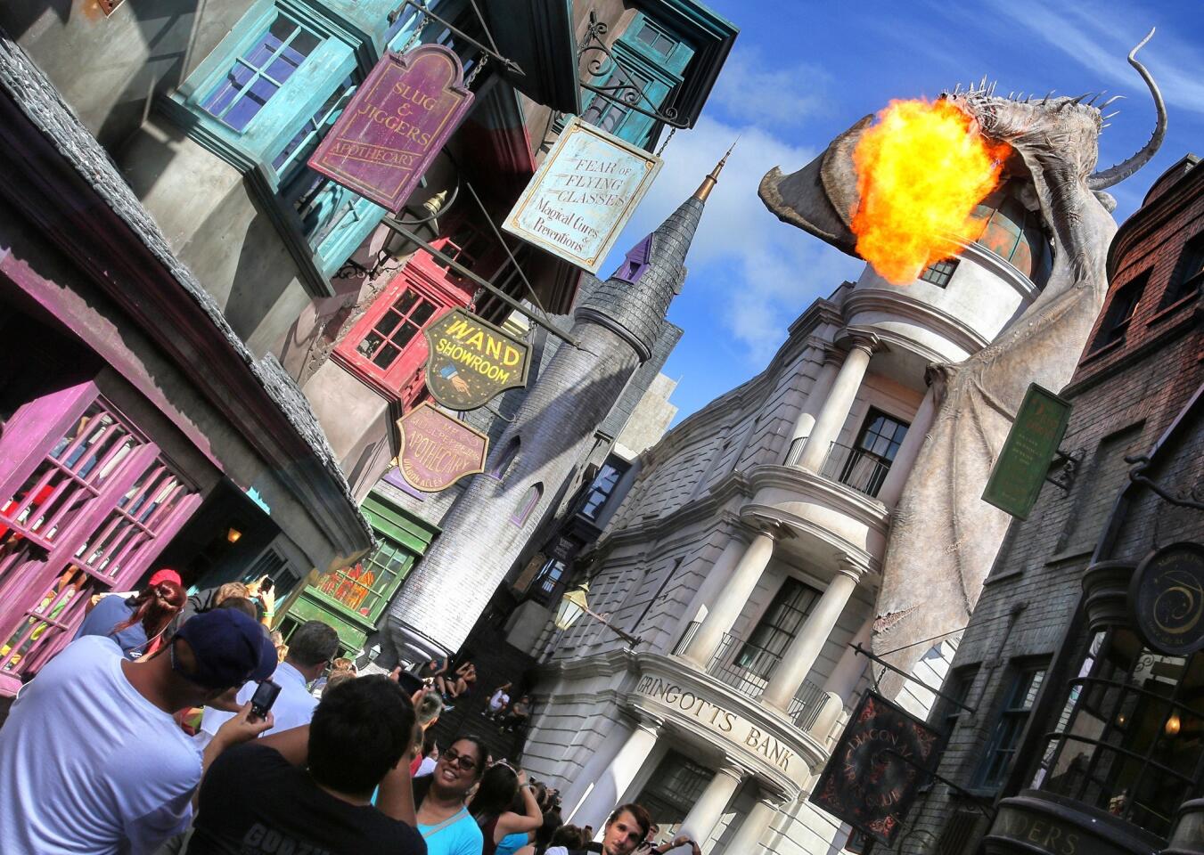 The fire-breathing dragon, perched on top of Diagon Alley, as seen during the grand opening at the Wizarding World of Harry Potter expansion, at Universal Studios Florida, in Orlando, Tuesday, July 8, 2014. (Joe Burbank/Orlando Sentinel) B583850553Z.1