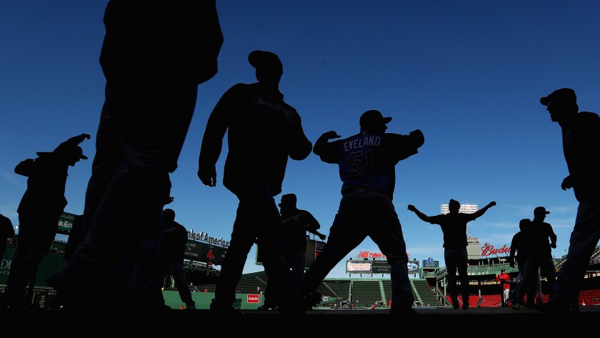 The Tampa Bay Rays warm up during batting practice before a game against the Boston Red Sox at Fenway Park.