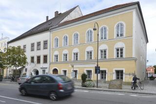 FILE - An exterior view of Adolf Hitler's birth house, front, in Braunau am Inn, Austria, on Sept. 27, 2012. Work started Monday Oct. 2, 2023 on turning the house where Adolf Hitler was born in 1889 into a police station, a project meant to make it unattractive as a site of pilgrimage for people who glorify the Nazi dictator. (AP Photo / Kerstin Joensson, File)