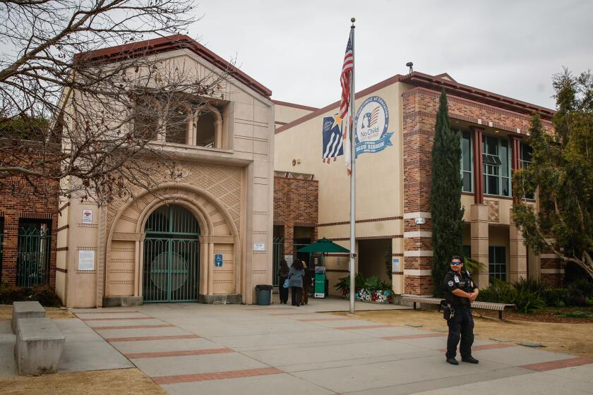 Beverly Hills, CA - February 26: Security guards stand outside at Beverly Vista Middle School on Monday, Feb. 26, 2024 in Beverly Hills, CA. (Jason Armond / Los Angeles Times)