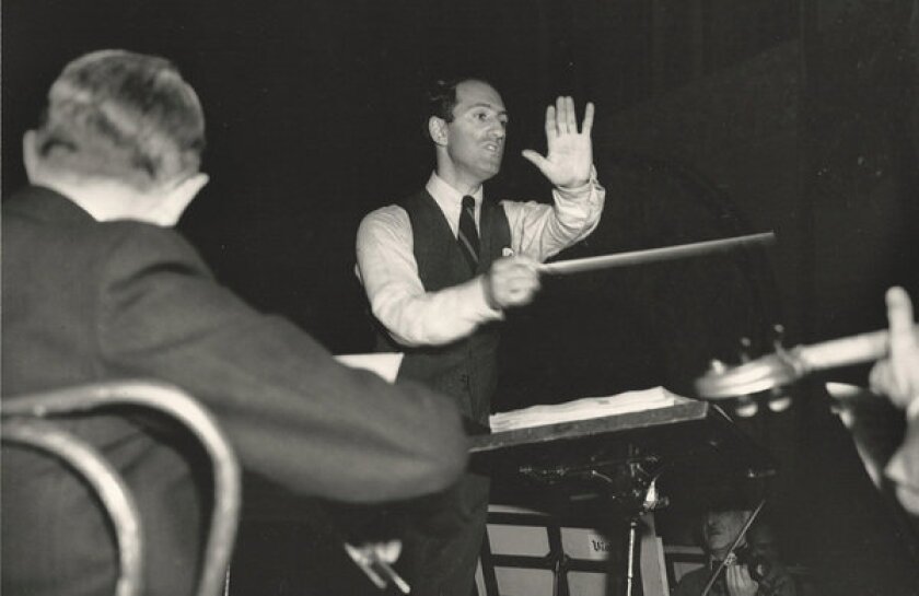 "Rhapsody in Blue" composer George Gershwin conducts members of the Los Angeles Philharmonic and other players during a rehearsal for two benefit concerts for musicians in February 1937.