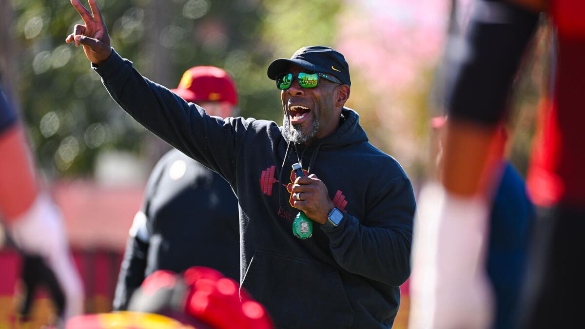 USC strength and conditioning coach Bennie Wylie shouts instructions during practice.