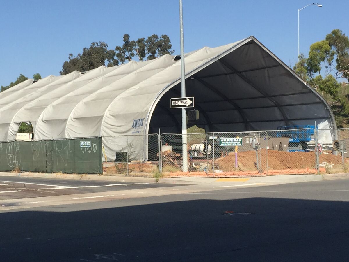 A large tented structure that will serve as a temporary shelter for 150 homeless people is under construction at 17th Street and Imperial Avenue in downtown San Diego and is expected to open by the end of the year. The San Diego City Council on Monday accepted a plan that has a goal of cutting the number of homeless people on the street in half within three years.