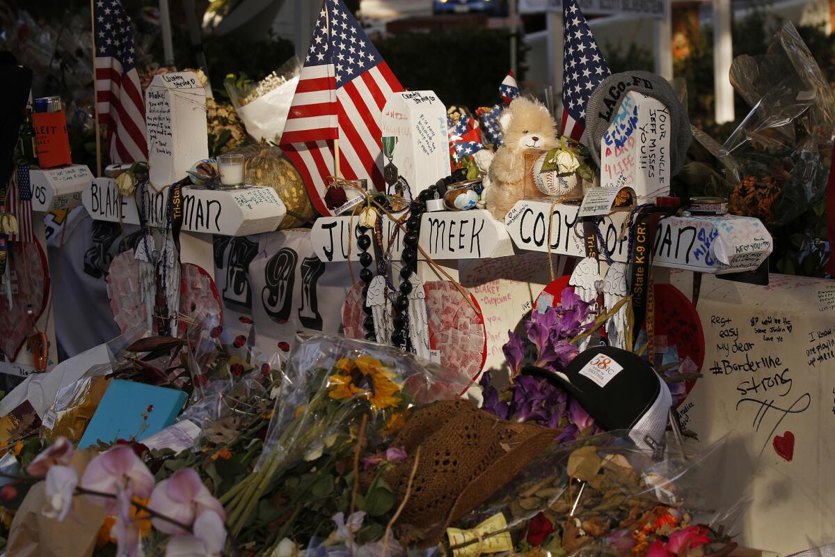 Crosses bear the names of the victims of the Borderline shooting.