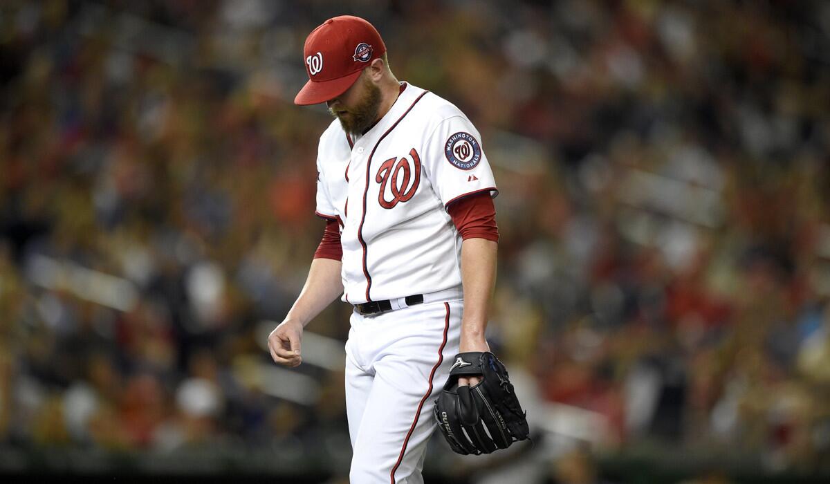 Washington Nationals relief pitcher Drew Storen walks off the field to the dugout during a game against the Colorado Rockies on Aug. 7.