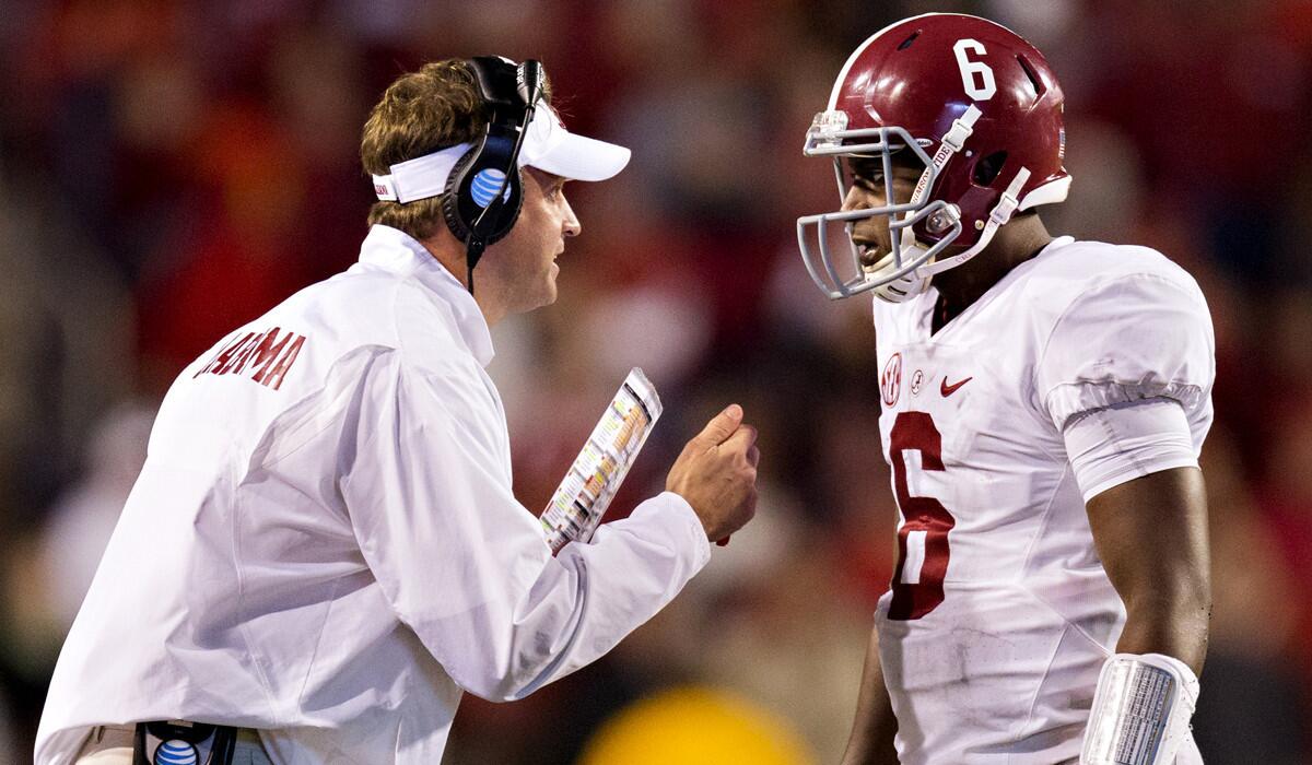 Alabama offensive coordinator Lane Kfffin talks with quarterback Blake Sims during a 14-13 victory over Arkansas on Oct. 11.