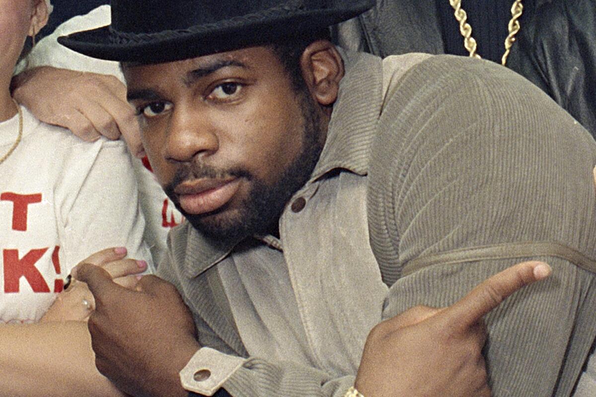 Run-DMC's Jam Master Jay crosses his arms and points outward with his index fingers