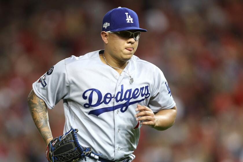 WASHINGTON, DC - OCTOBER 07: Julio Urias #7 of the Los Angeles Dodgers leaves the game in the fifth inning against the Washington Nationals in game four of the National League Division Series at Nationals Park on October 07, 2019 in Washington, DC. (Photo by Rob Carr/Getty Images)