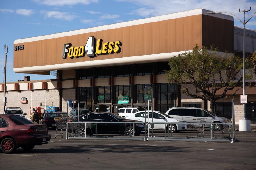LONG BEACH, CA - FEBRUARY 02: Shoppers enter a Food4Less that Kroger, its parent company will shut down in response to the city imposing a "hero pay" increase of 4 dollars per house on Tuesday, Feb. 2, 2021 in Long Beach, CA. The Food4Less is located at 2185 E. South St. (Dania Maxwell / Los Angeles Times)