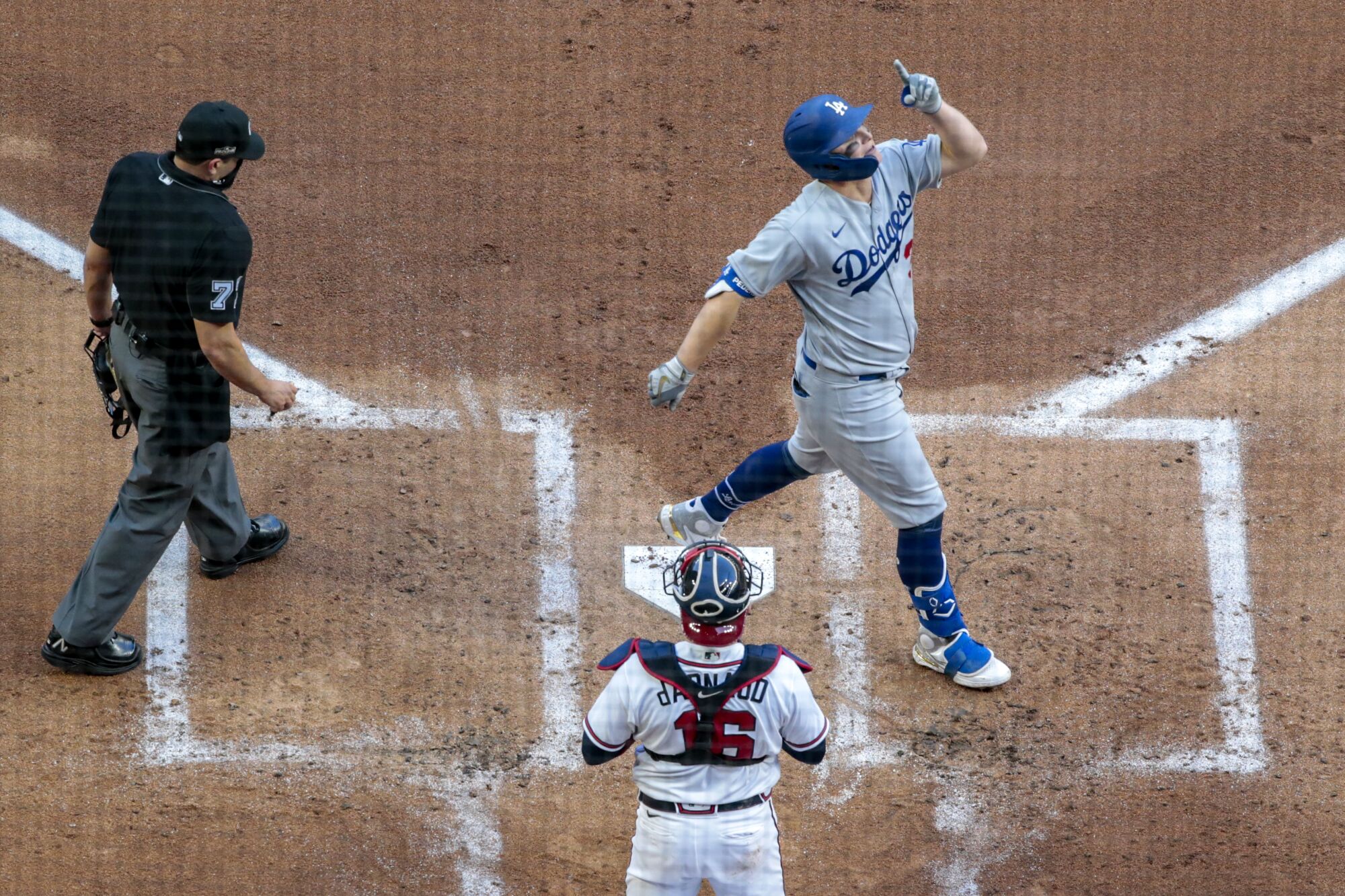 Dodgers left fielder Joc Pederson celebrates as he crosses the plate after hitting a three-run home run in the first inning.