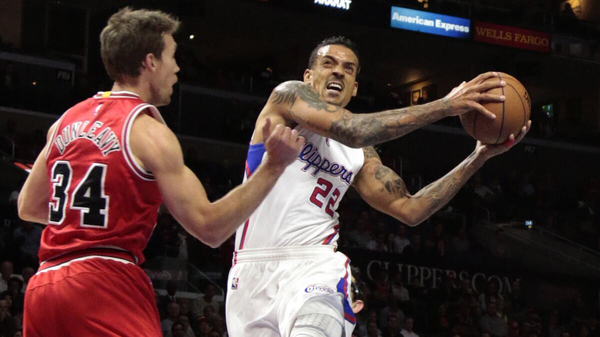 Clippers small forward Matt Barnes, right, operates against Chicago Bulls forward Mike Dunleavy during a game at Staples Center on Nov. 14, 2014.