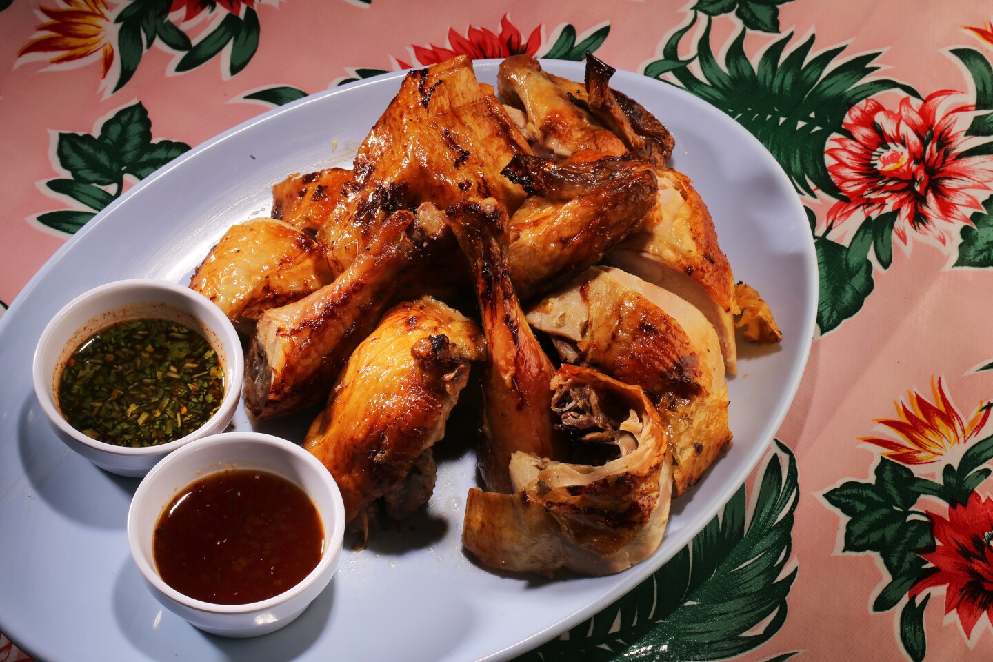 Kai Yaang is roasted Mary's natural chicken stuffed with lemongrass, garlic, pepper and cilantro and served with spicy/sweet/sour and tamarind dipping sauces. Half bird sells for $14.00 and whole bird sells for $25.00.