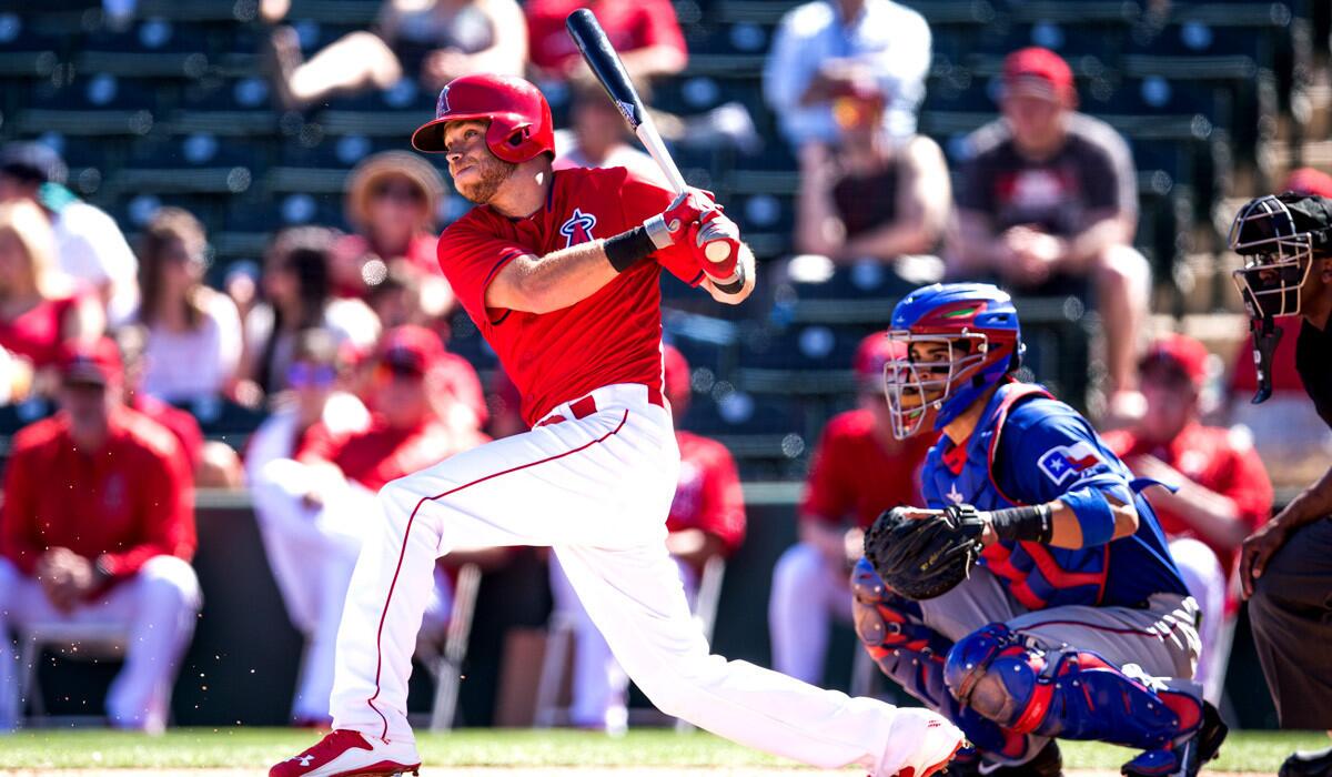 Angels infielder Taylor Featherston bats during a spring training game against the Texas Rangers on Tuesday.