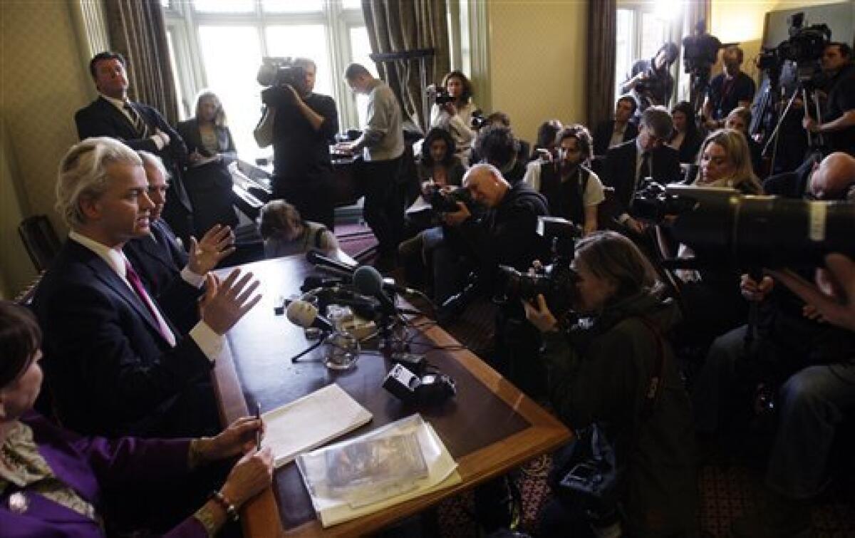 Controversial Dutch politician Geert Wilders, seated at center, speaks during a press conference in London, flanked by Lord Pearson of Rannoch, the leader of the United Kingdom Independence Party (UKIP), seated at right, and Baroness Cox, seated at left, Friday, March 5, 2010. Dozens of demonstrators gathered outside of Britain's Parliament on Friday, ahead of the viewing of an anti-Islam film by Dutch politician Geert Wilders, whose strong showing in a local elections sparked concern that his anti-immigrant views have become widely accepted in the Netherlands. (AP Photo/Matt Dunham)
