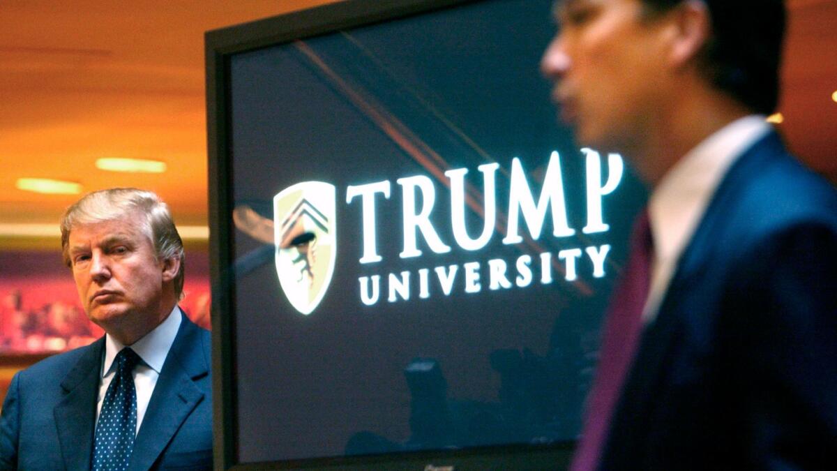Donald Trump in 2005 listens as he is introduced at a news conference in New York where he announced the establishment of Trump University.