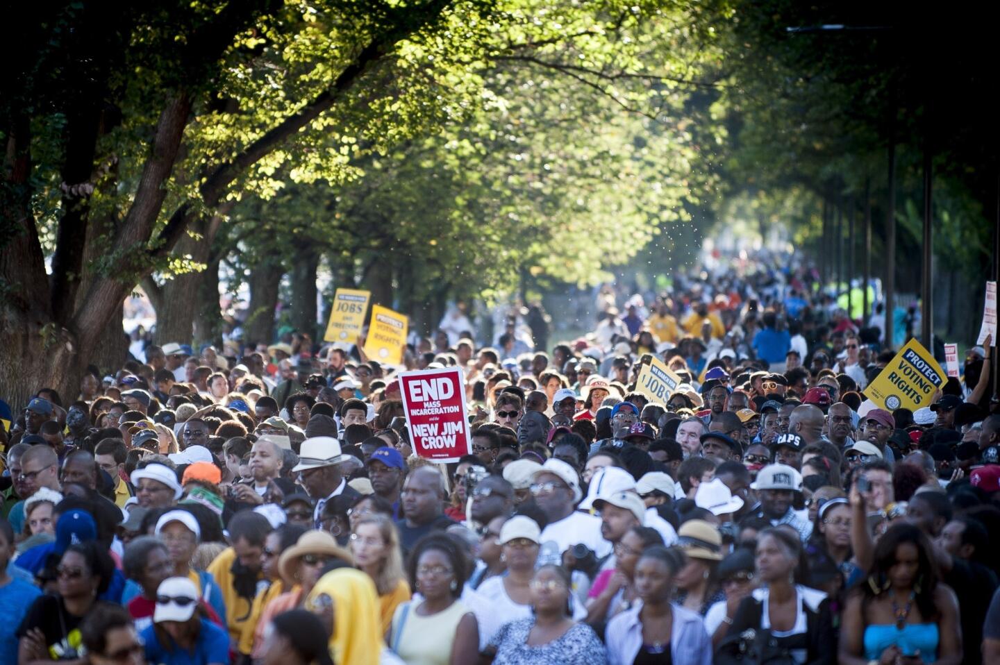 People arrive at the National Mall to celebrate the 50th anniversary of the March on Washington and the Rev. Martin Luther King Jr.'s "I Have a Dream" speech.
