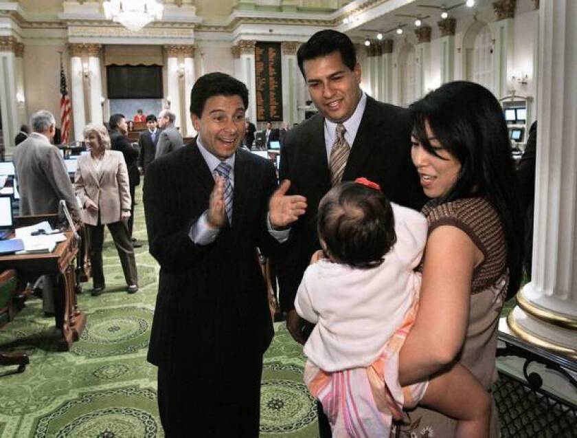 Former Assembly Speaker Fabian Nuñez meets with the family of Assemblyman Felipe Fuentes (D-Sylmar) in 2007. After having revived the teacher evaluation bill in the last few weeks, Fuentes, second from left, said: “I could not in good conscience allow the proposed amendments to be voted on without a full public hearing. I believe this issue is too important to be decided at the last minute and in the dark of night.”