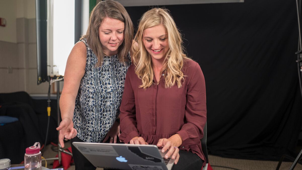 Jami Mathewson, left, and Samantha Erickson of the Wiki Education Foundation go over notes prior to an educational video they are recording at the UC San Francisco School of Medicine.