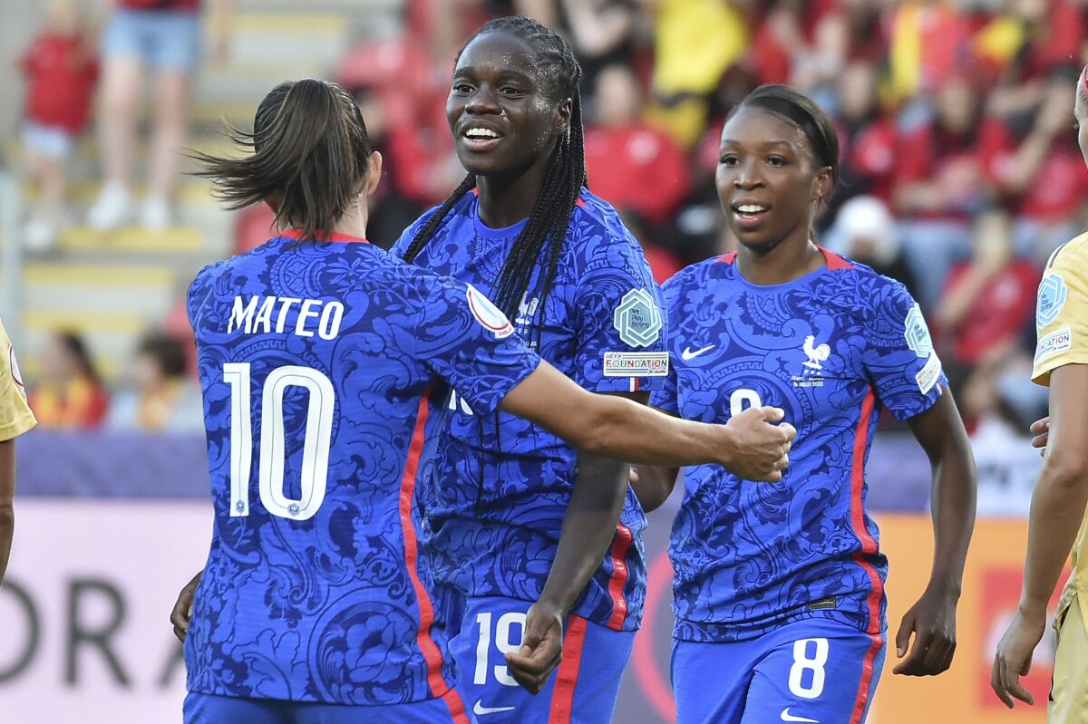France's Griedge Mbock Bathy, centre, celebrates after scoring her side's second goal during the Women Euro 2022 group D soccer match between France and Belgium, at the New York Stadium, Rotherham, England, Thursday July 14, 2022. (AP Photo/Rui Vieira)