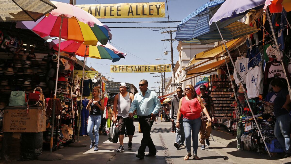 Shoppers hunt for bargains in Santee Alley, a popular destination in the Fashion District.