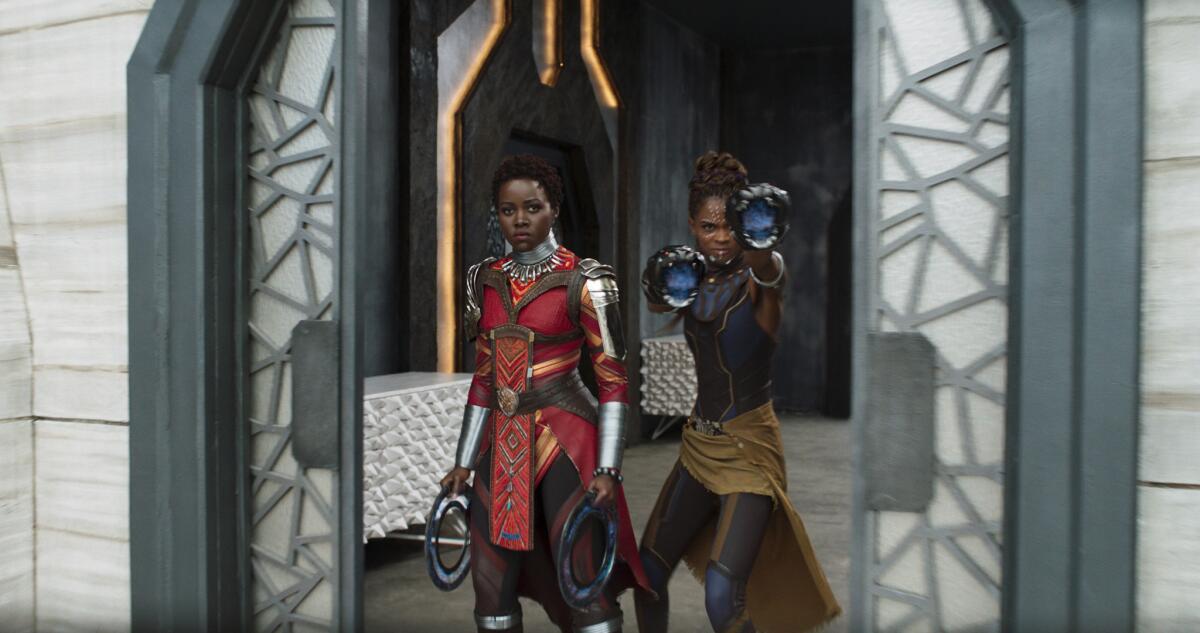 Lupita Nyong'o and Letitia Wright in a scene from "Black Panther."