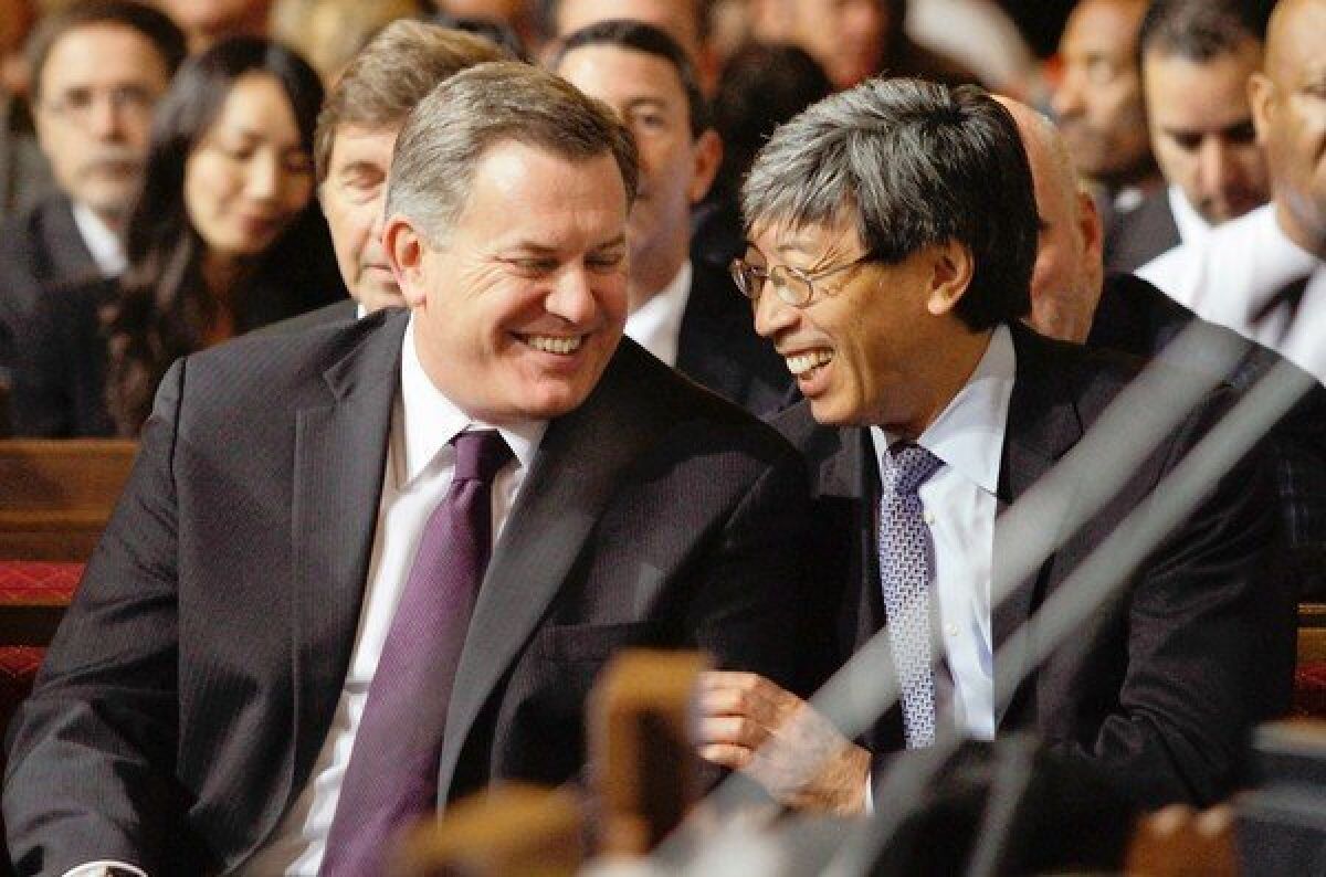 AEG chief Tim Leiweke, left, with prospective buyer Dr. Patrick Soon-Shiong. Leiweke apologized for the “dysfunction” caused by the sale announcement.
